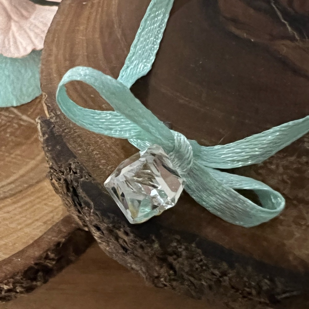 Glass diamond like pendent. Delicately beautiful. Antique. Encased in silver.
